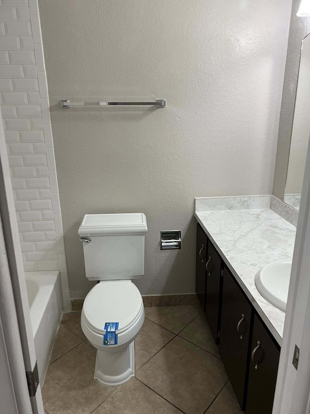318 NW Byron St, Port Saint Lucie, FL 34983 - bathroom with vanity, toilet, and tile patterned flooring