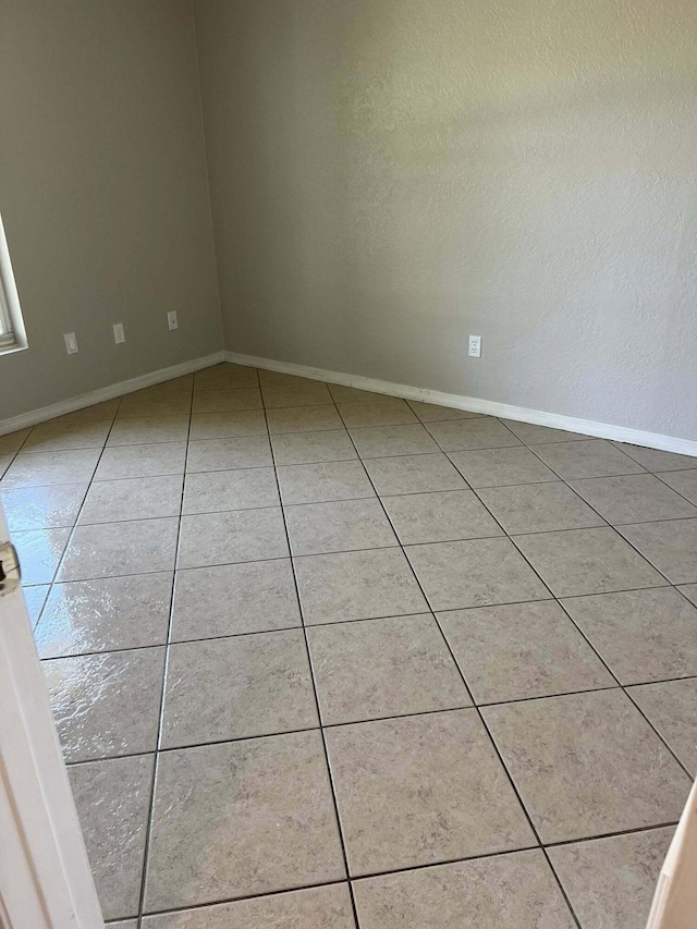 318 NW Byron St, Port Saint Lucie, FL 34983 - unfurnished room with light tile patterned floors and baseboards