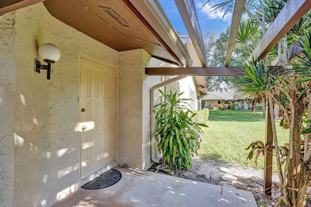10112 Marwood Pl, Boynton Beach, FL 33437 - entrance to property featuring stucco siding and a lawn