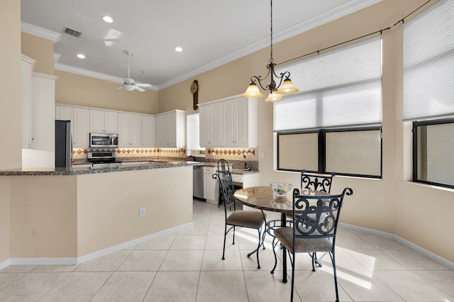 6908 Adriano Dr, Boynton Beach, FL 33437 - dining room featuring ornamental molding, light tile patterned floors, recessed lighting, ceiling fan, and a chandelier