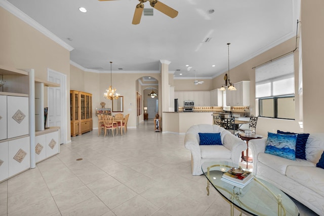 6908 Adriano Dr, Boynton Beach, FL 33437 - living area featuring ceiling fan, a chandelier, arched walkways, crown molding, and light tile patterned floors