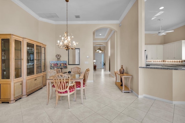 6908 Adriano Dr, Boynton Beach, FL 33437 - dining room featuring arched walkways, a ceiling fan, ornamental molding, a chandelier, and light tile patterned floors