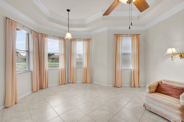 6908 Adriano Dr, Boynton Beach, FL 33437 - living area featuring a raised ceiling, healthy amount of natural light, ornamental molding, baseboards, and light tile patterned floors