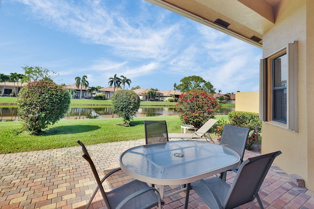 6908 Adriano Dr, Boynton Beach, FL 33437 - view of patio / terrace featuring a water view, outdoor dining space, and a residential view