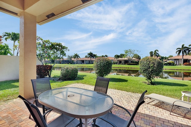 6908 Adriano Dr, Boynton Beach, FL 33437 - view of patio with outdoor dining area, a water view, and a residential view