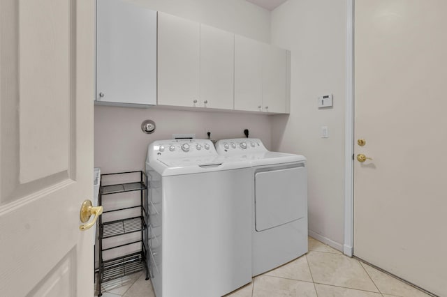 6908 Adriano Dr, Boynton Beach, FL 33437 - washroom with cabinet space, independent washer and dryer, and light tile patterned flooring