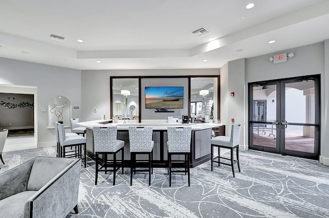 6908 Adriano Dr, Boynton Beach, FL 33437 - indoor wet bar featuring recessed lighting, baseboards, french doors, and a raised ceiling
