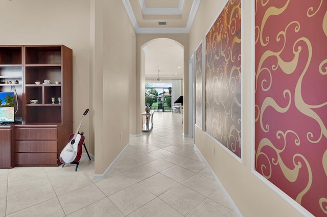 6908 Adriano Dr, Boynton Beach, FL 33437 - hall featuring ornamental molding, arched walkways, light tile patterned floors, and baseboards
