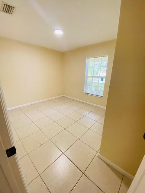 1270 SW 11th Ct SW, Vero Beach, FL 32962 - spare room featuring baseboards, light tile patterned floors, and recessed lighting