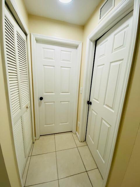 1270 SW 11th Ct SW, Vero Beach, FL 32962 - hallway with light tile patterned flooring