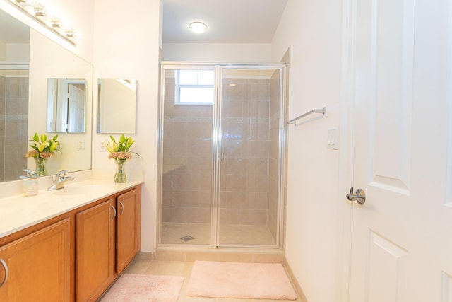 433 Amador Ln Unit 1, West Palm Beach, FL 33401 - bathroom with vanity, a stall shower, and tile patterned floors