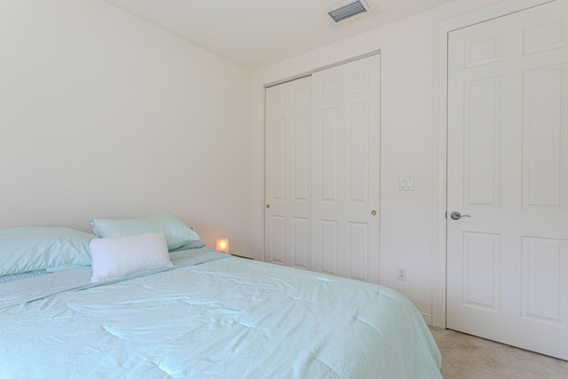 433 Amador Ln Unit 1, West Palm Beach, FL 33401 - bedroom featuring light colored carpet and a closet