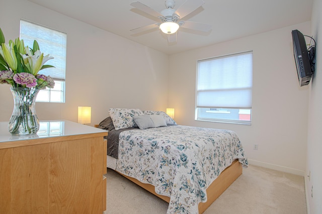 433 Amador Ln Unit 1, West Palm Beach, FL 33401 - bedroom with light carpet, baseboards, and a ceiling fan