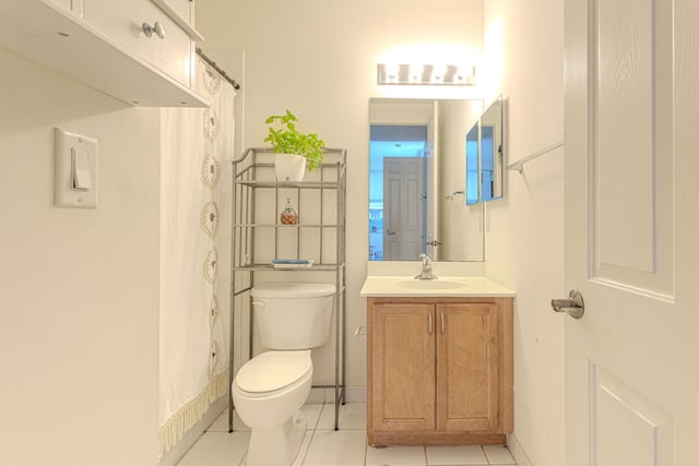 433 Amador Ln Unit 1, West Palm Beach, FL 33401 - bathroom with toilet, vanity, tile patterned floors, and a shower with curtain