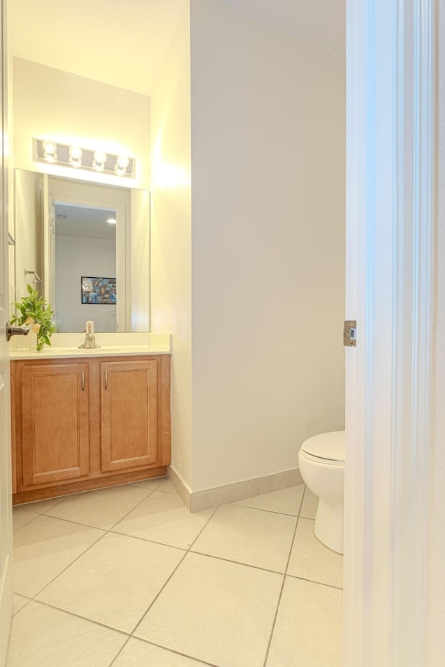 433 Amador Ln Unit 1, West Palm Beach, FL 33401 - half bath featuring toilet, tile patterned floors, vanity, and baseboards