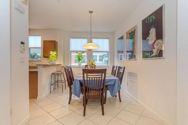 433 Amador Ln Unit 1, West Palm Beach, FL 33401 - dining area featuring light tile patterned floors and baseboards