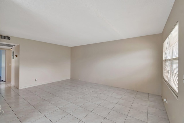 393 Fanshaw J, Boca Raton, FL 33434 - spare room featuring light tile patterned floors