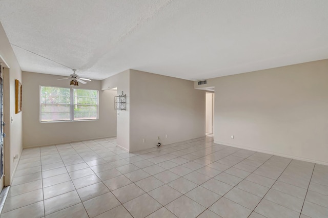 393 Fanshaw J, Boca Raton, FL 33434 - unfurnished room with ceiling fan, a textured ceiling, and light tile patterned floors