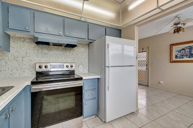 393 Fanshaw J, Boca Raton, FL 33434 - kitchen with freestanding refrigerator, electric stove, blue cabinetry, and under cabinet range hood