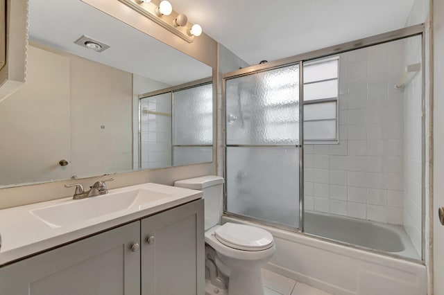 393 Fanshaw J, Boca Raton, FL 33434 - full bath with vanity, toilet, combined bath / shower with glass door, and tile patterned floors