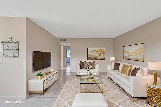 393 Fanshaw J, Boca Raton, FL 33434 - living area featuring light tile patterned floors and baseboards