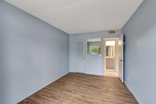 393 Fanshaw J, Boca Raton, FL 33434 - empty room featuring light wood finished floors and baseboards