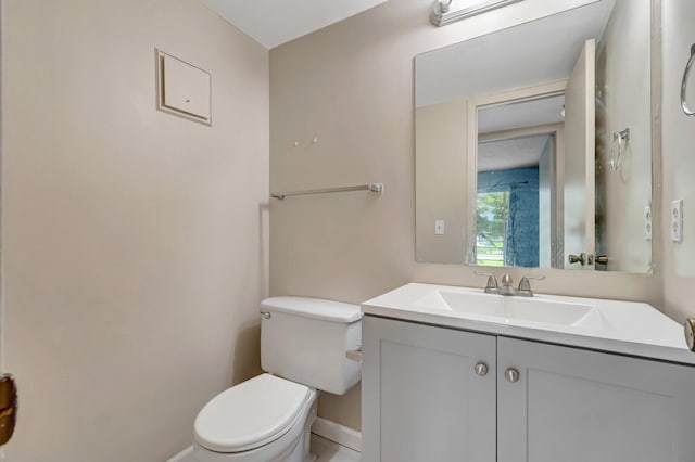 393 Fanshaw J, Boca Raton, FL 33434 - bathroom featuring toilet, baseboards, and vanity
