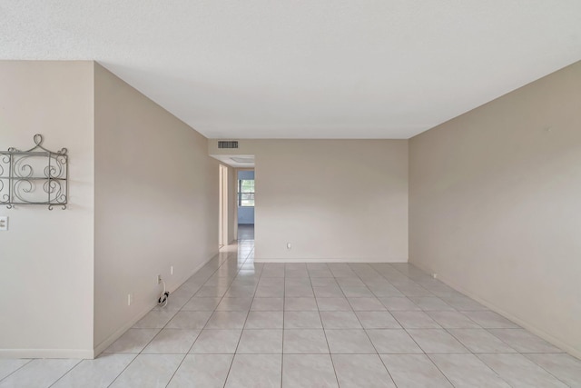 393 Fanshaw J, Boca Raton, FL 33434 - spare room with light tile patterned floors and baseboards