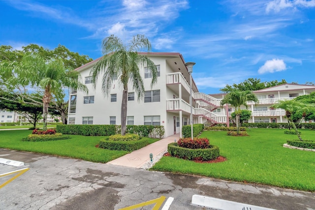 393 Fanshaw J, Boca Raton, FL 33434 - view of property with uncovered parking