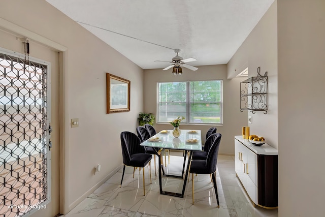 393 Fanshaw J, Boca Raton, FL 33434 - dining area featuring light marble finish floors, ceiling fan, and baseboards