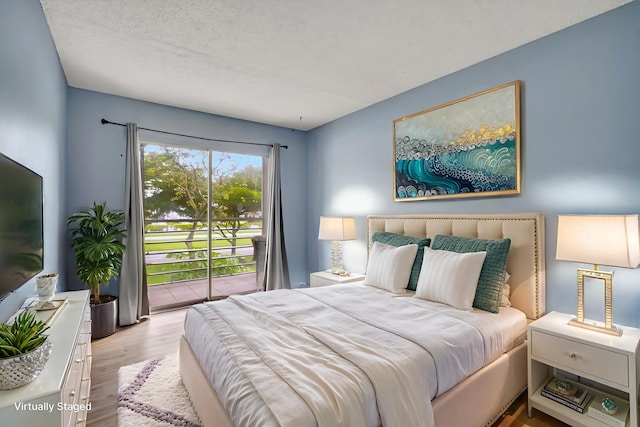 393 Fanshaw J, Boca Raton, FL 33434 - bedroom featuring wood finished floors and access to exterior