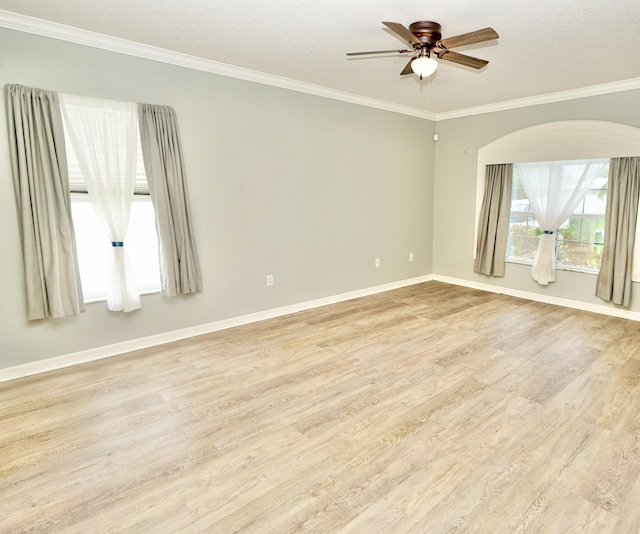 1985 SW Glenco St, Port Saint Lucie, FL 34953 - unfurnished room with light wood-style floors, ornamental molding, ceiling fan, and baseboards