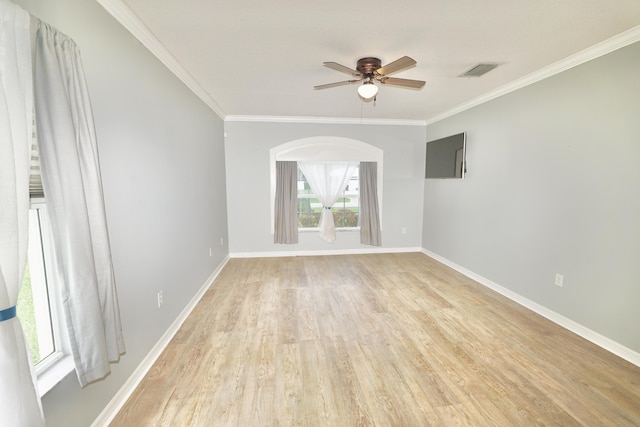 1985 SW Glenco St, Port Saint Lucie, FL 34953 - unfurnished room featuring light wood-style flooring, a ceiling fan, ornamental molding, and baseboards