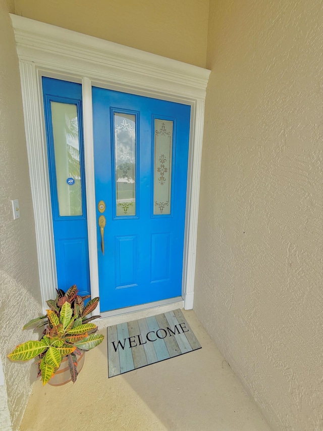 1985 SW Glenco St, Port Saint Lucie, FL 34953 - property entrance featuring stucco siding