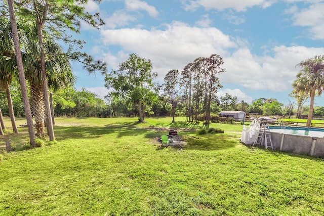 18564 48th Ave N, The Acreage, FL 33470 - view of grassy yard featuring an outdoor pool