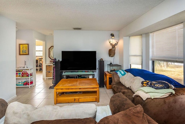 18564 48th Ave N, The Acreage, FL 33470 - tiled living room with a textured ceiling