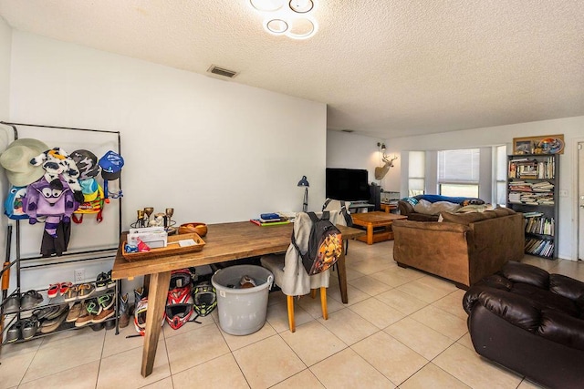 18564 48th Ave N, The Acreage, FL 33470 - dining room featuring a textured ceiling and light tile patterned flooring