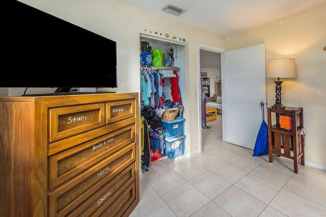 18564 48th Ave N, The Acreage, FL 33470 - bedroom featuring a closet and light tile patterned flooring