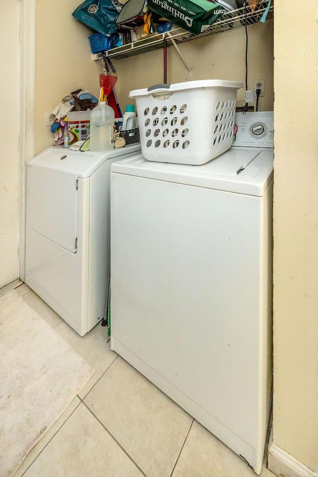 18564 48th Ave N, The Acreage, FL 33470 - laundry room with independent washer and dryer and light tile patterned flooring