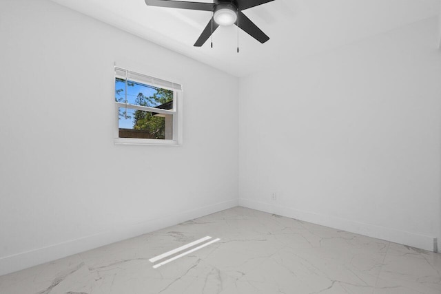 2949 NE 12th Ter, Pompano Beach, FL 33064 - empty room featuring light marble finish flooring, baseboards, and a ceiling fan