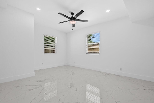 2949 NE 12th Ter, Pompano Beach, FL 33064 - empty room featuring baseboards, recessed lighting, light marble finish floors, and ceiling fan