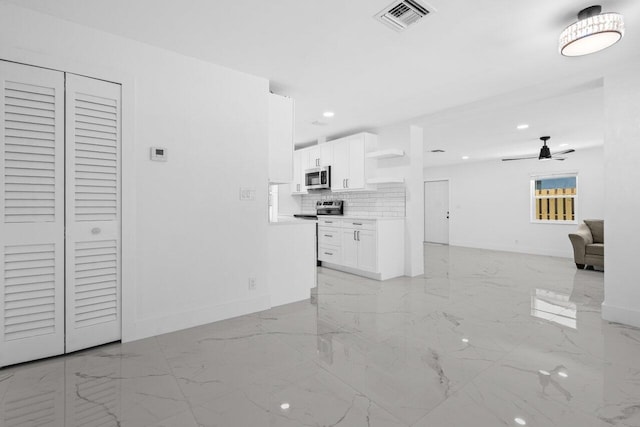 2949 NE 12th Ter, Pompano Beach, FL 33064 - unfurnished living room with light marble finish flooring, ceiling fan, baseboards, and recessed lighting