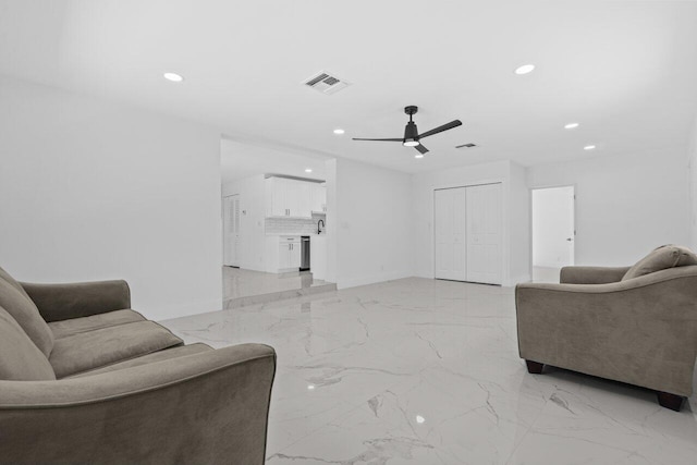 2949 NE 12th Ter, Pompano Beach, FL 33064 - living room with light marble finish floors, recessed lighting, a ceiling fan, and baseboards