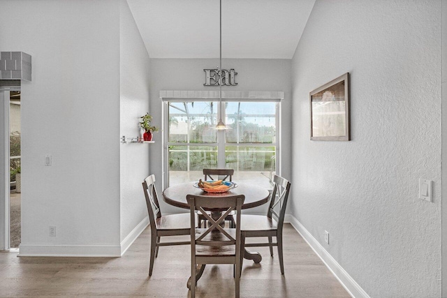 9391 Aqua Vista Blvd, Boynton Beach, FL 33437 - dining area with a textured wall, wood finished floors, and baseboards