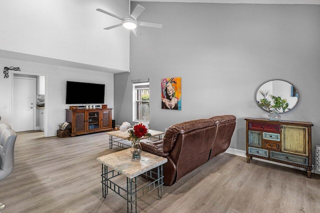9391 Aqua Vista Blvd, Boynton Beach, FL 33437 - living area featuring a ceiling fan, wood finished floors, a high ceiling, and baseboards