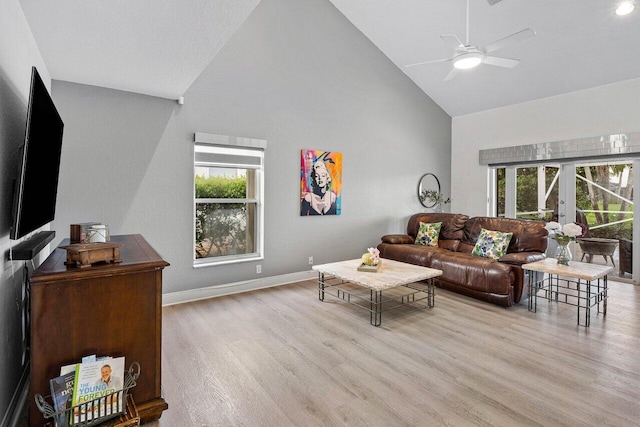 9391 Aqua Vista Blvd, Boynton Beach, FL 33437 - living area with high vaulted ceiling, a ceiling fan, plenty of natural light, wood finished floors, and baseboards