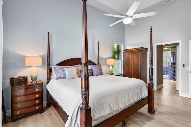9391 Aqua Vista Blvd, Boynton Beach, FL 33437 - bedroom with baseboards, light wood-style flooring, a high ceiling, and a ceiling fan