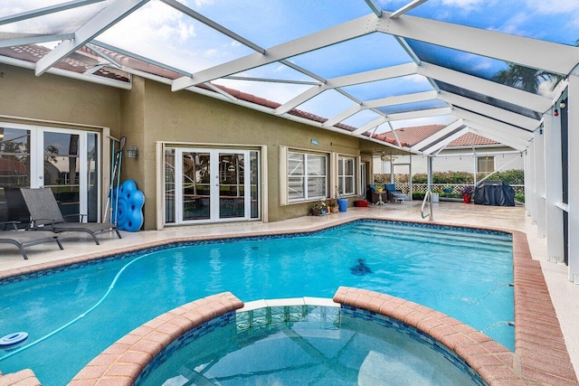 9391 Aqua Vista Blvd, Boynton Beach, FL 33437 - view of pool with a pool with connected hot tub, a patio area, and glass enclosure