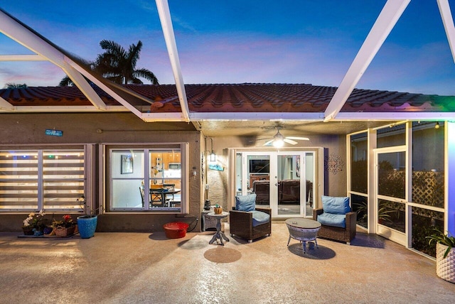 9391 Aqua Vista Blvd, Boynton Beach, FL 33437 - back of house at dusk with french doors, a patio area, stucco siding, and ceiling fan