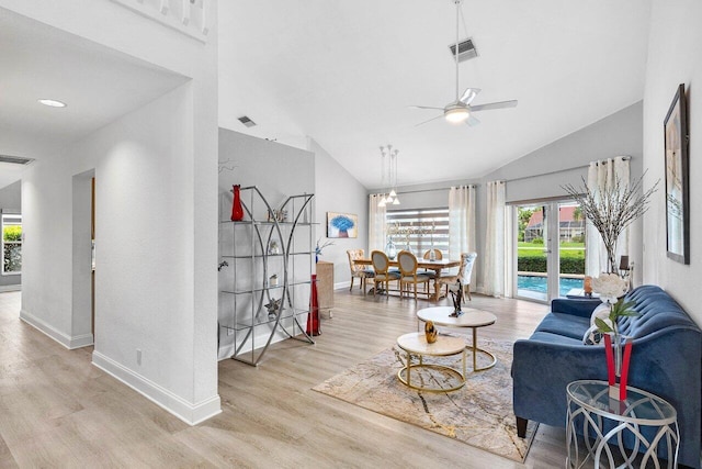 9391 Aqua Vista Blvd, Boynton Beach, FL 33437 - living room featuring vaulted ceiling, a ceiling fan, wood finished floors, and baseboards